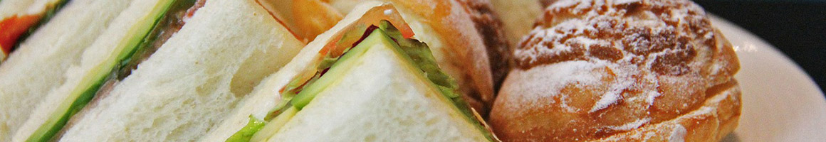 Eating Sandwich at Supreme Sandwiches restaurant in Houston, TX.